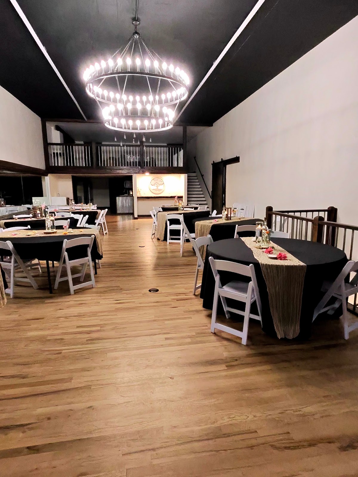 Round tables set for a dinner in The Burland ballroom